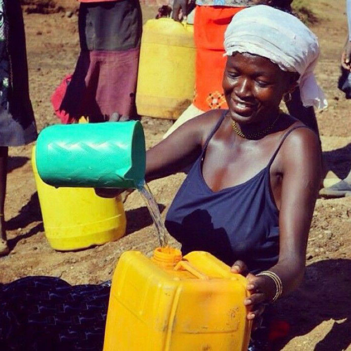 Smiling child drinking clean water